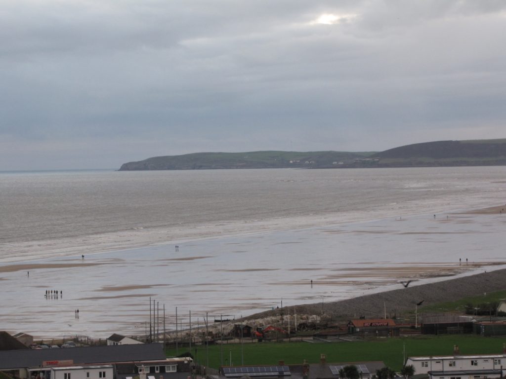 In The Escalator, Cas grieves at the seaside, moving from cityscape to seascape